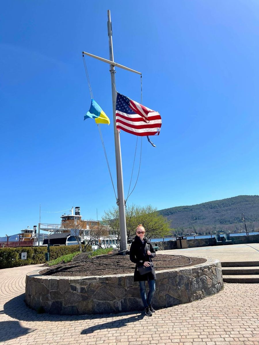 Khrystyna Voloshyn Ukrainian and American flags together