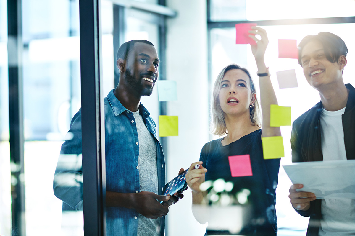 People looking at sticky notes